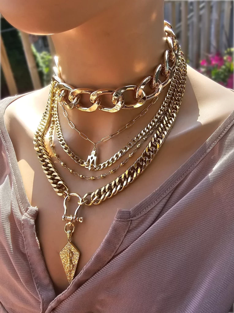 Handmade gold layered multi-strand chunky chain gothic choker necklace set on a black velvet background.
